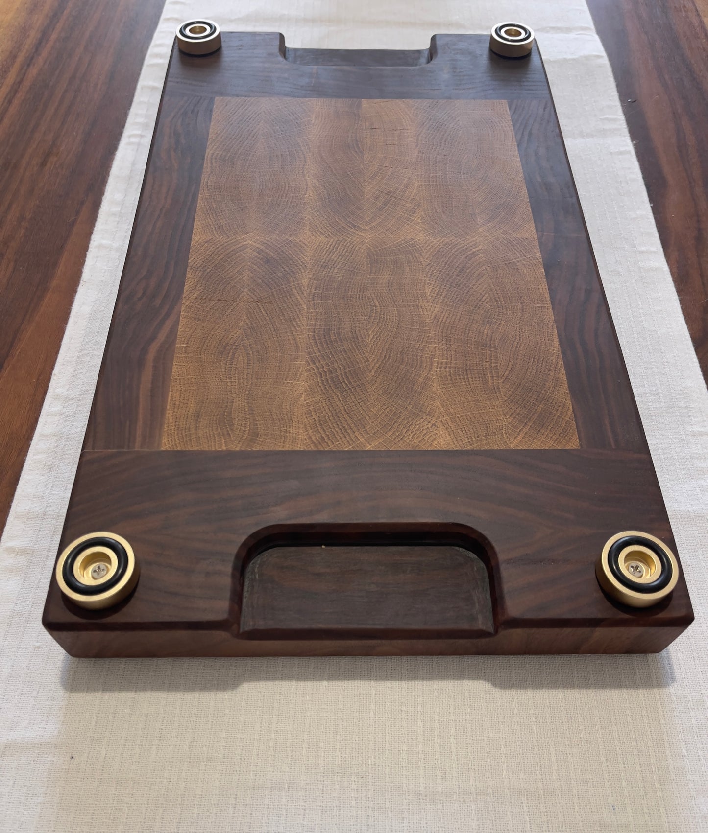 Unique endgrain walnut and white oak cutting board with elegant metal golden feet.