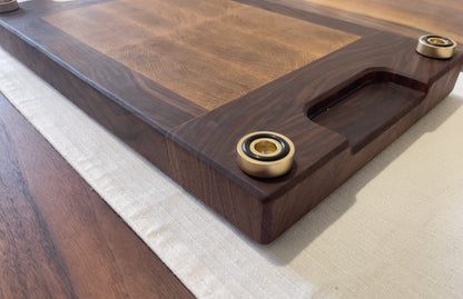 Unique endgrain walnut and white oak cutting board with elegant metal golden feet.