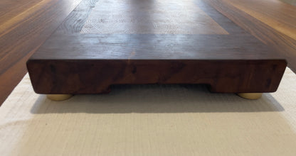 Unique endgrain walnut and white oak cutting board with elegant metal golden feet.