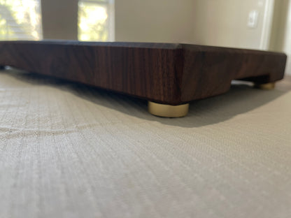 Unique endgrain walnut and white oak cutting board with elegant metal golden feet.